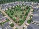 Aerial view of a community garden and fire pit in a neighborhood at 151 Bridge St, Hillsborough, NC 27278