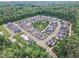 Beautiful aerial view of a planned community surrounded by lush greenery and mature trees in a serene setting at 151 Bridge St, Hillsborough, NC 27278