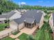 View of the home's backyard featuring a screened porch, patio, and well-maintained lawn at 151 Bridge St, Hillsborough, NC 27278