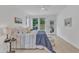 Bright bedroom with a ceiling fan and carpet floors at 151 Bridge St, Hillsborough, NC 27278