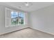 Bright bedroom featuring a large window with views of the pool and community at 151 Bridge St, Hillsborough, NC 27278