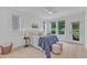 Bright bedroom with a ceiling fan and access to the backyard at 151 Bridge St, Hillsborough, NC 27278