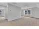 Large bonus room with carpet flooring, a ceiling fan, and ample natural light at 151 Bridge St, Hillsborough, NC 27278