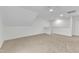 Bonus room with carpet, recessed lighting, and staircase access at 151 Bridge St, Hillsborough, NC 27278