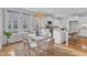 Charming dining area with stylish lighting, a white table, and natural light at 151 Bridge St, Hillsborough, NC 27278