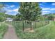 A dog park with a black fence and walking trail at 151 Bridge St, Hillsborough, NC 27278