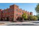 Brick building with an inviting outdoor seating area and charming architectural details at 151 Bridge St, Hillsborough, NC 27278