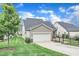 Well-manicured lawn and landscaping highlight this home's curb appeal at 151 Bridge St, Hillsborough, NC 27278