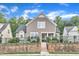 Inviting two-story home featuring a stone retaining wall and a well-maintained front yard at 151 Bridge St, Hillsborough, NC 27278