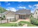 Exterior of home features a screened porch, patio, and fenced backyard at 151 Bridge St, Hillsborough, NC 27278