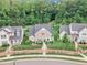 An eye-level exterior showcases well-manicured landscaping and a charming facade at 151 Bridge St, Hillsborough, NC 27278