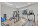 The room features a treadmill, bike, weights and other exercise equipment at 151 Bridge St, Hillsborough, NC 27278
