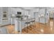 Modern kitchen boasting granite countertops, a central island, and stainless steel appliances at 151 Bridge St, Hillsborough, NC 27278
