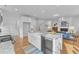 Well-lit kitchen with granite countertops, an island, and stainless steel appliances at 151 Bridge St, Hillsborough, NC 27278