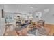 Open-concept living space with modern furnishings and hardwood floors throughout at 151 Bridge St, Hillsborough, NC 27278
