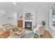 Cozy living room featuring a fireplace, comfortable seating, and stylish decor at 151 Bridge St, Hillsborough, NC 27278