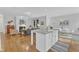 Open concept living room featuring hardwood floors and a fireplace at 151 Bridge St, Hillsborough, NC 27278