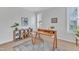 Bright office with a modern desk, decor, and natural light streaming through shuttered windows at 151 Bridge St, Hillsborough, NC 27278