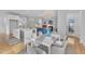 Open-concept layout showcasing a dining area, kitchen, and connected living spaces at 151 Bridge St, Hillsborough, NC 27278