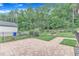 Paver patio and small garden area in a beautifully landscaped backyard at 151 Bridge St, Hillsborough, NC 27278