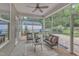 Inviting screened-in porch featuring comfortable seating and views of the backyard at 151 Bridge St, Hillsborough, NC 27278