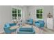 Relaxing common room area with four cozy armchairs and large windows at 151 Bridge St, Hillsborough, NC 27278