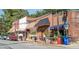 Charming street view with a variety of shops, potted plants, and pedestrian-friendly sidewalks at 151 Bridge St, Hillsborough, NC 27278