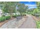 A sidewalk with a bench for resting and relaxing at 151 Bridge St, Hillsborough, NC 27278