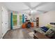 Inviting bedroom with wood floor, large window for natural light and space for sitting area at 151 Lake Pine Dr, Cary, NC 27511