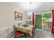 Bright dining room with colorful table setting, modern lighting, and sliding glass door leading to the deck at 151 Lake Pine Dr, Cary, NC 27511