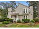 Charming two-story home with a well-manicured lawn and mature trees, and private front entrance at 151 Lake Pine Dr, Cary, NC 27511