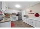 Efficient kitchen with white cabinets, stainless steel appliances, and a functional layout for easy meal preparation at 151 Lake Pine Dr, Cary, NC 27511