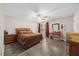 Comfortable main bedroom with wood floors, ceiling fan and natural light from window at 151 Lake Pine Dr, Cary, NC 27511