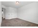 Bedroom with neutral walls, ceiling light, and carpeted floor, featuring 2 entry doors at 1728 Shady Oaks Dr, Wendell, NC 27591