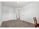 Bedroom features neutral carpet, chair, and multiple doorways, with plenty of room for customization at 1728 Shady Oaks Dr, Wendell, NC 27591