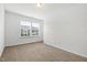 Bright bedroom featuring carpeting, crisp white walls and a large window with natural light at 1728 Shady Oaks Dr, Wendell, NC 27591