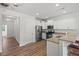 Modern kitchen features stainless steel appliances, granite countertops, and a breakfast bar for casual dining at 1728 Shady Oaks Dr, Wendell, NC 27591