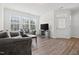 Bright living room with lots of natural light and hard surface floors for a contemporary look at 1728 Shady Oaks Dr, Wendell, NC 27591