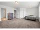 Spacious main bedroom featuring neutral carpeting, crisp white walls, and abundant natural light at 1728 Shady Oaks Dr, Wendell, NC 27591