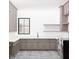 Spacious laundry room featuring custom cabinets, ample counter space, a utility sink, and modern washer and dryer at 1808 Stream Manor Ct, Wake Forest, NC 27587