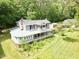 Aerial view of the home showing the outdoor living space, including the porch and landscaped grounds at 183 Birnamwood Dr, Chapel Hill, NC 27516