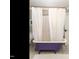 Vintage bathroom with purple clawfoot tub, patterned floors, and a shower with white curtain at 183 Birnamwood Dr, Chapel Hill, NC 27516