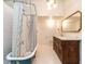 Stylish bathroom featuring a classic clawfoot tub, detailed vanity, and ample lighting at 183 Birnamwood Dr, Chapel Hill, NC 27516
