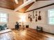 Spacious bonus room includes instruments, wooden floors, and windows allowing natural light to brighten the room at 183 Birnamwood Dr, Chapel Hill, NC 27516