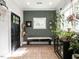 Welcoming entryway features a bench, decorative window, and ample natural light with space for plants at 183 Birnamwood Dr, Chapel Hill, NC 27516