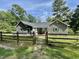 Home exterior with a fenced yard and a gate at 183 Birnamwood Dr, Chapel Hill, NC 27516