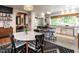 Bright kitchen with a large island, breakfast bar, white cabinetry, and modern appliances at 183 Birnamwood Dr, Chapel Hill, NC 27516