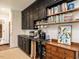 Butler's pantry area provides extra storage and countertop space with dark cabinets and open shelving at 183 Birnamwood Dr, Chapel Hill, NC 27516