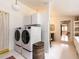 Laundry room with washer, dryer, cabinets, and laundry room sink at 183 Birnamwood Dr, Chapel Hill, NC 27516