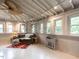 Sunlit living room features a ceiling fan and large windows at 183 Birnamwood Dr, Chapel Hill, NC 27516